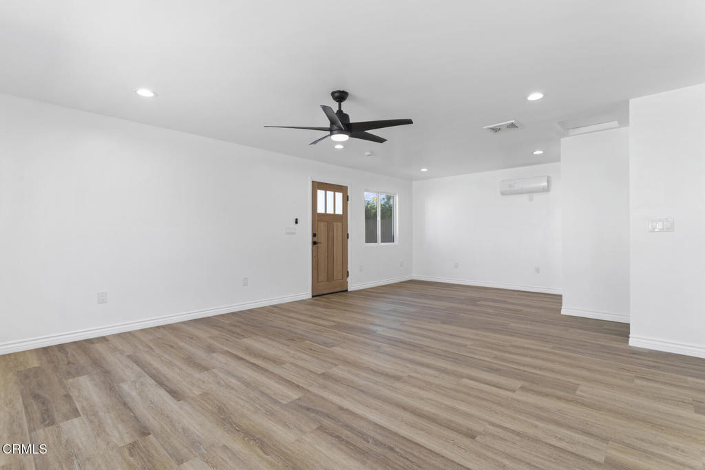 3308 Primavera Street Pasadena, CA 91107 - Photo 15 of 26 wooden floor in an empty room with a window