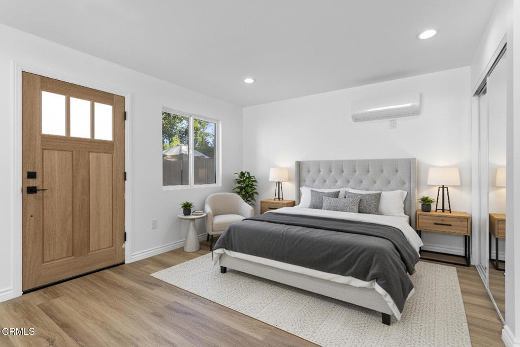 3308 Primavera Street Pasadena, CA 91107 - Photo 18 of 26 a bedroom with a bed and wooden floor