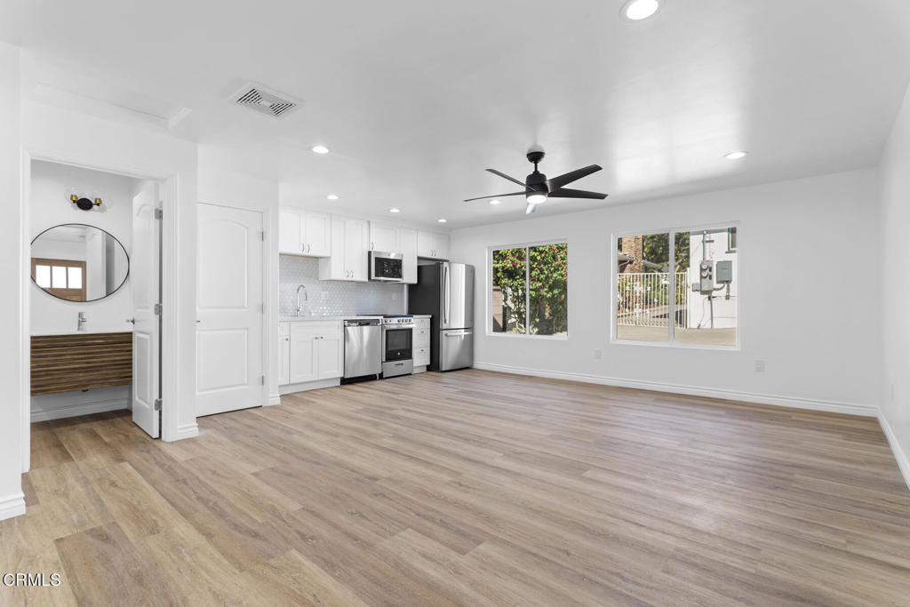3308 Primavera Street Pasadena, CA 91107 - Photo 8 of 26 an empty room with windows and cabinet