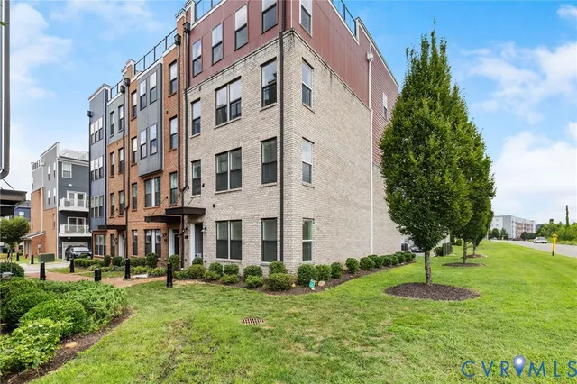 a view of a building with a yard