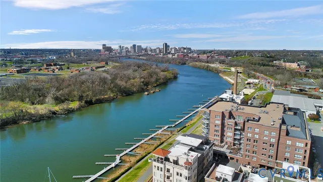an aerial view of residential building and lake