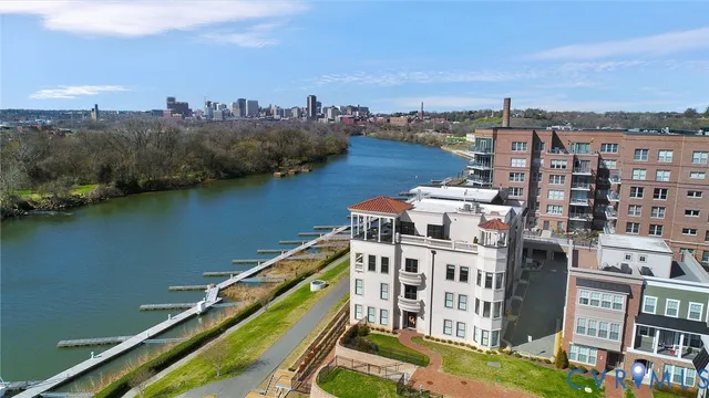 an aerial view of a house with a lake view