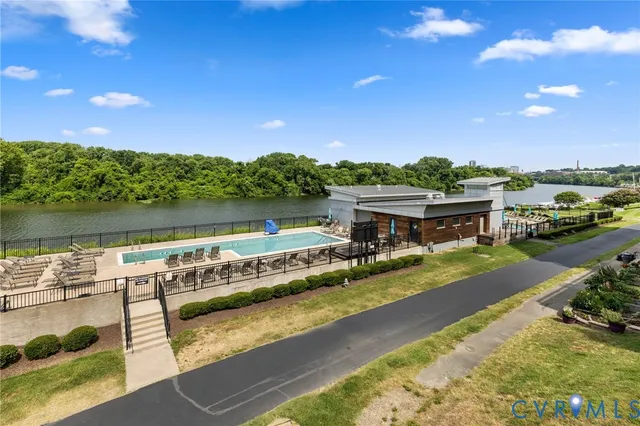 a view of a swimming pool with a lake view
