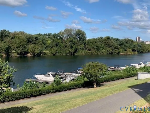 an aerial view of a houses with a lake view