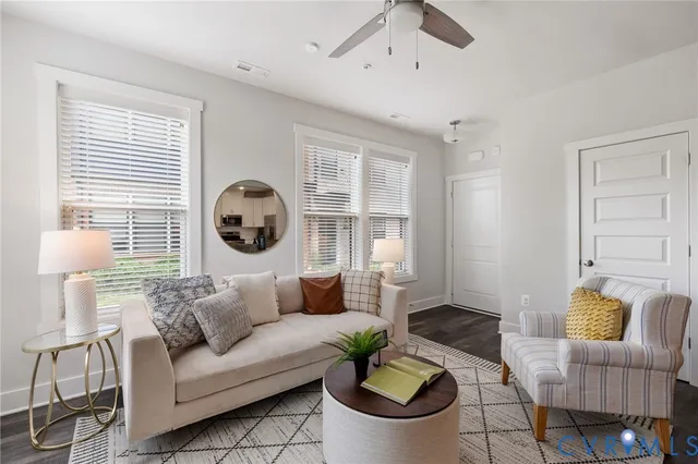 a living room with furniture and a large window