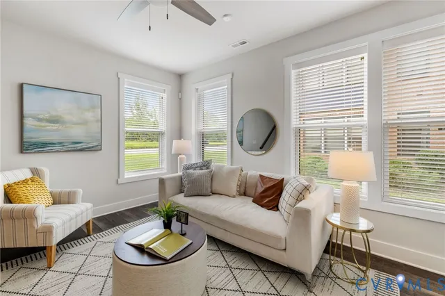 a living room with furniture and a window