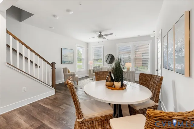 a view of a dining room with furniture window and wooden floor