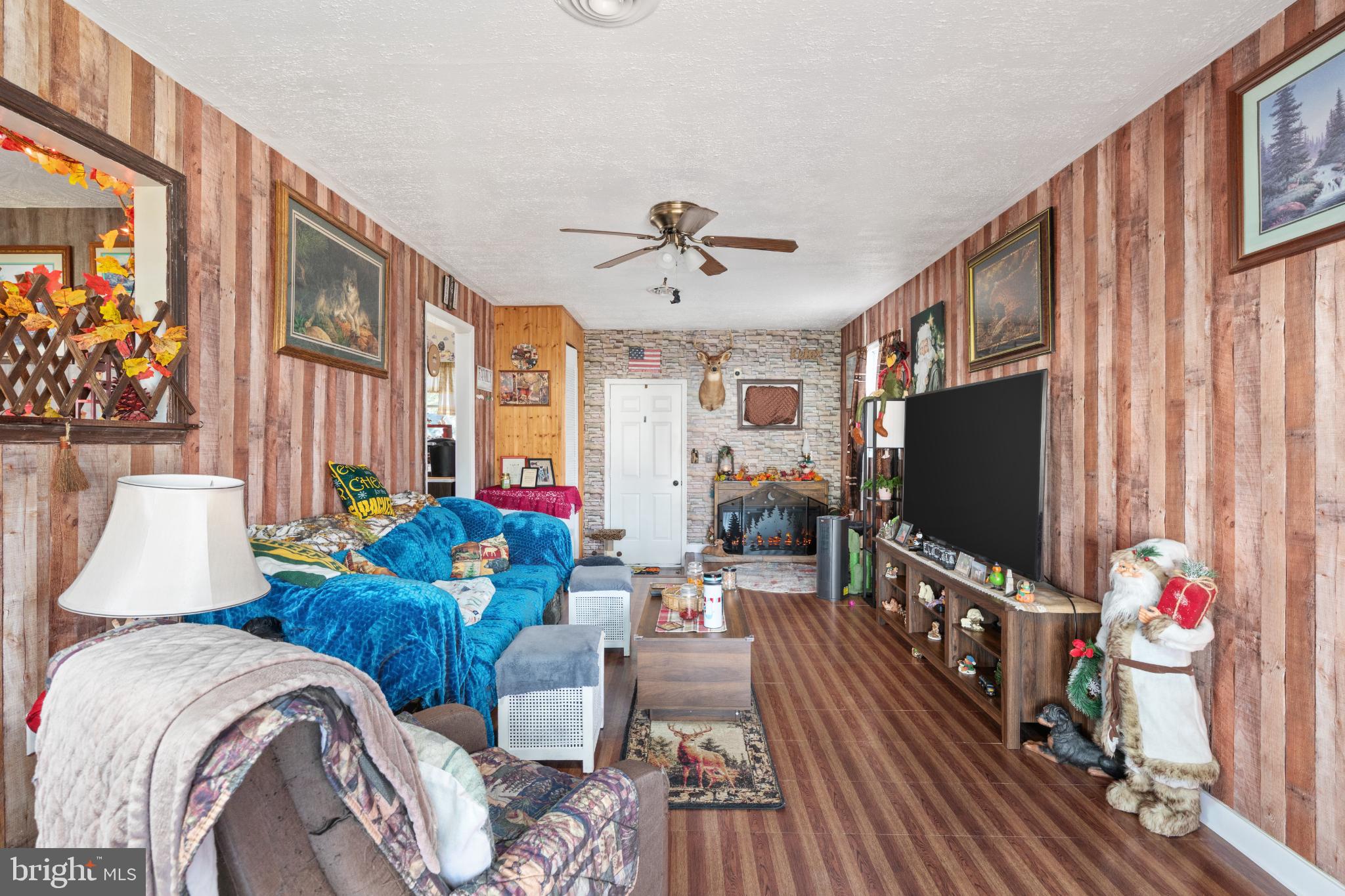63 Declaration Drive Inwood, WV 25428 - Photo 13 of 25 a living room with furniture and a flat screen tv