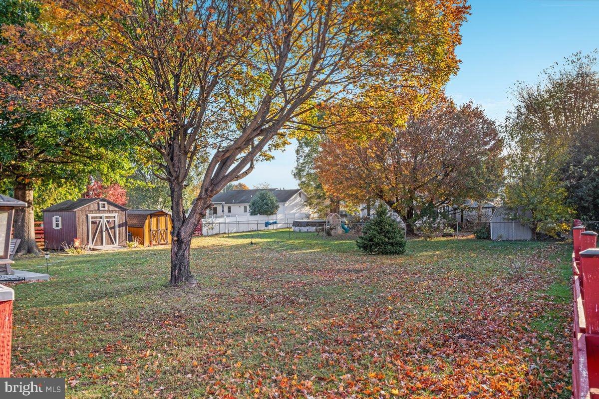 63 Declaration Drive Inwood, WV 25428 - Photo 2 of 25 a view of a yard with a house