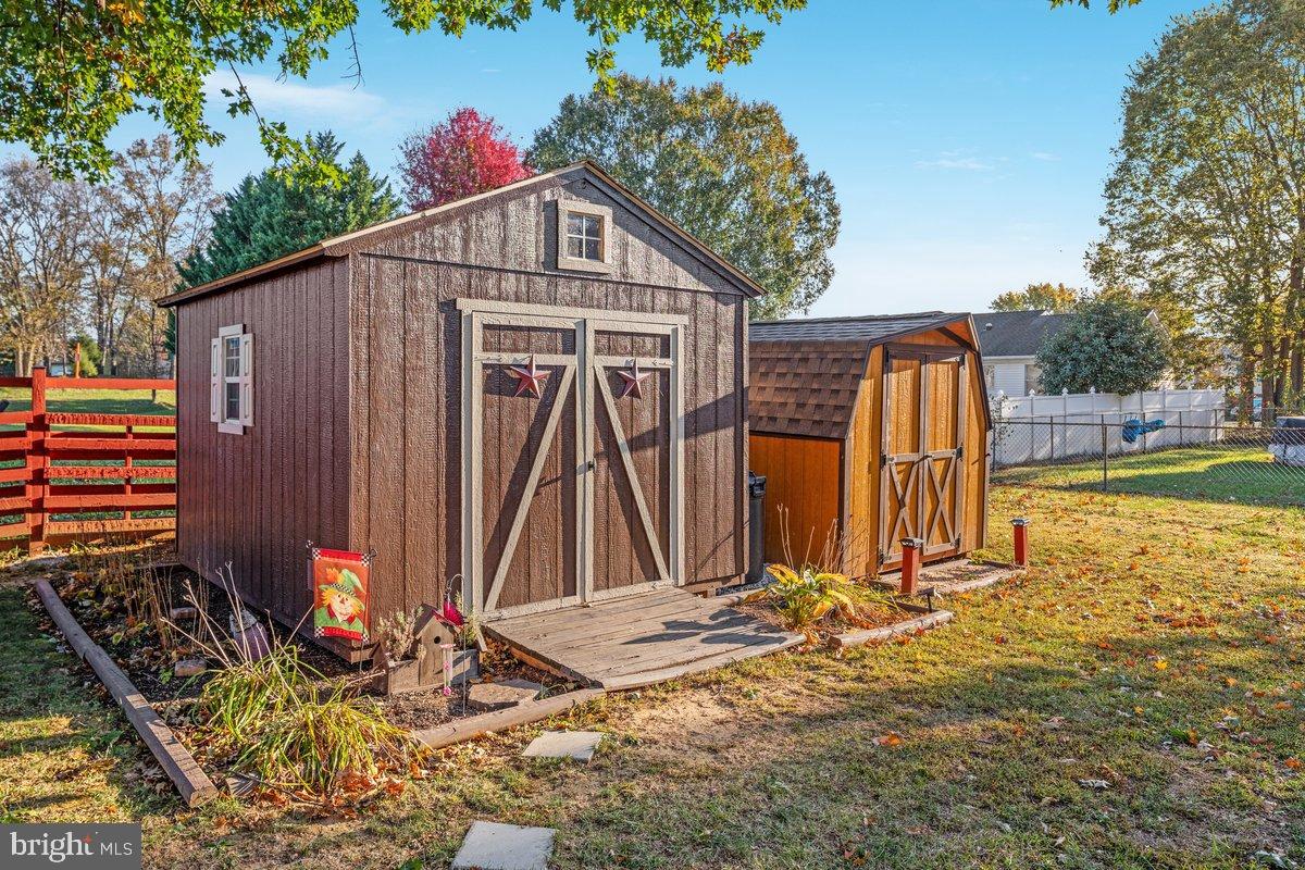 63 Declaration Drive Inwood, WV 25428 - Photo 21 of 25 a front view of a house with garden