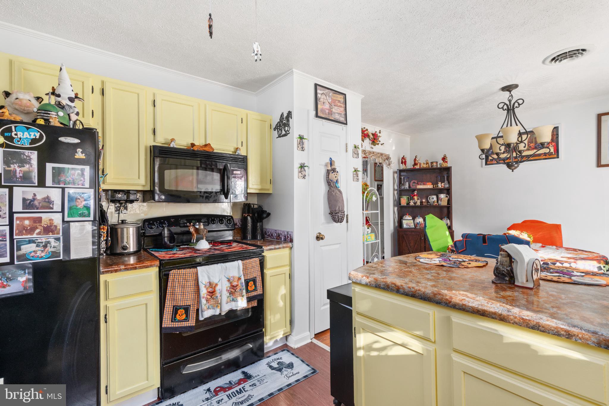 63 Declaration Drive Inwood, WV 25428 - Photo 8 of 25 a kitchen with stainless steel appliances a stove refrigerator sink and microwave