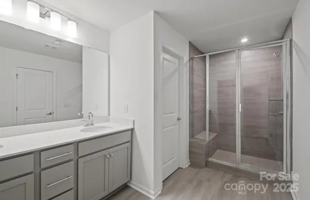 a bathroom with a shower sink and toilet