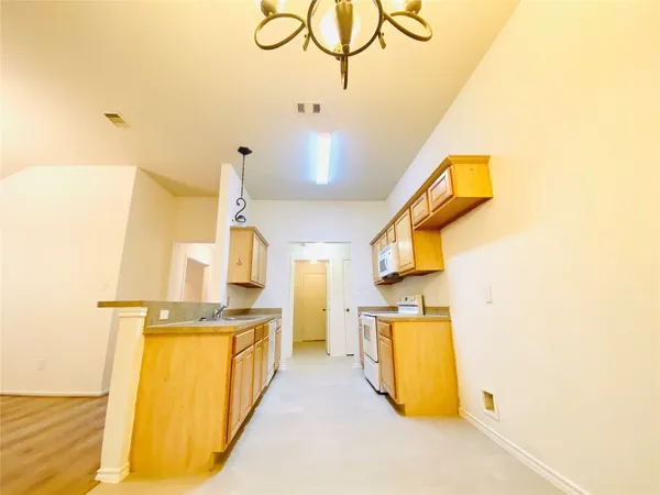 a view of a kitchen storage and utility room