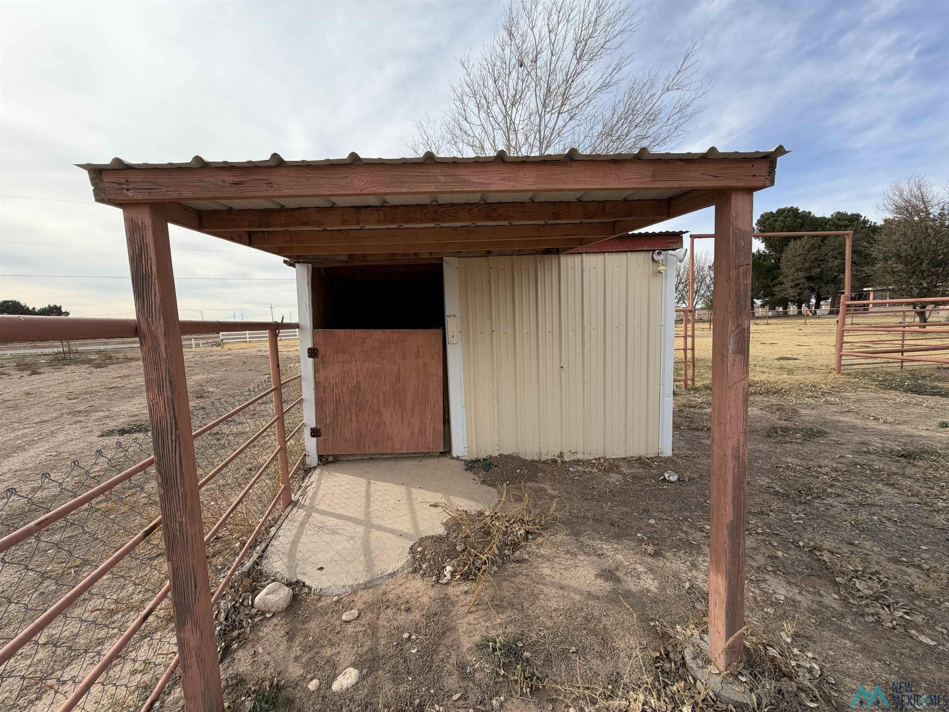 2001 East Derrick Road Carlsbad, NM 88220 - Photo 37 of 84 View of outbuilding featuring a rural view