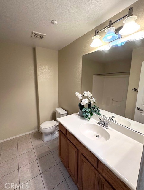 8692 East 9th Street, Unit 56 Rancho Cucamonga, CA 91730 - Photo 22 of 34 a bathroom with a sink a toilet and mirror