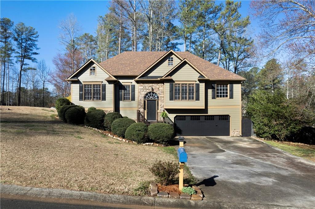 a front view of a house with a yard