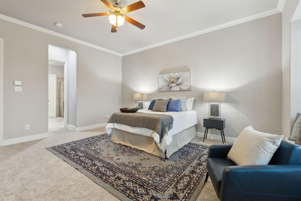 2610 Sunset Bay Lane Nevada, TX 75173 - Photo 19 of 34 a bedroom with a large bed and a couch