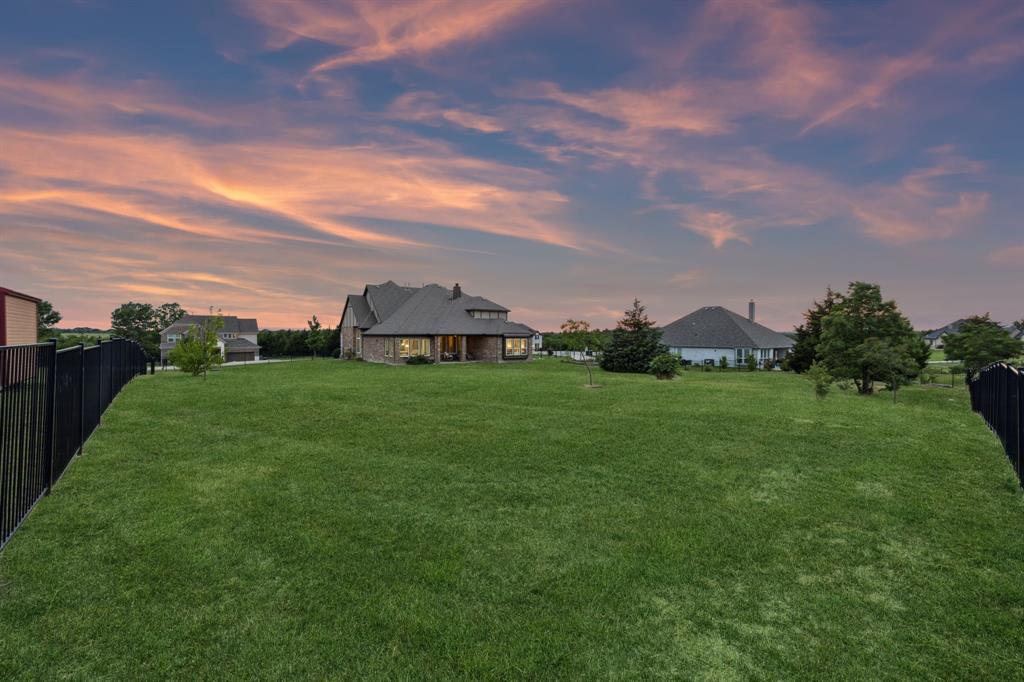 2610 Sunset Bay Lane Nevada, TX 75173 - Photo 3 of 34 a view of a garden with house in the background