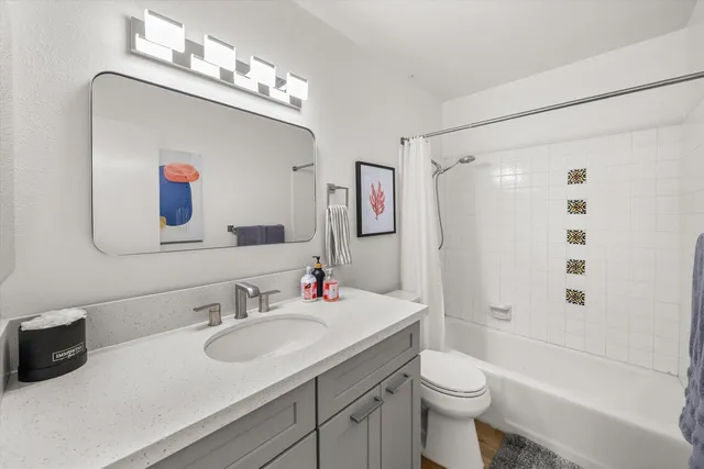 a bedroom with a bed and a desk