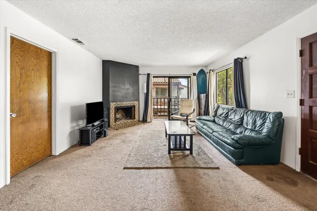 a view of a car park in front of house