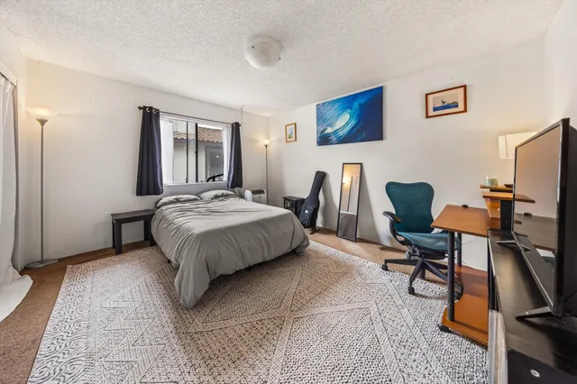 an aerial view of a house with a yard and garden