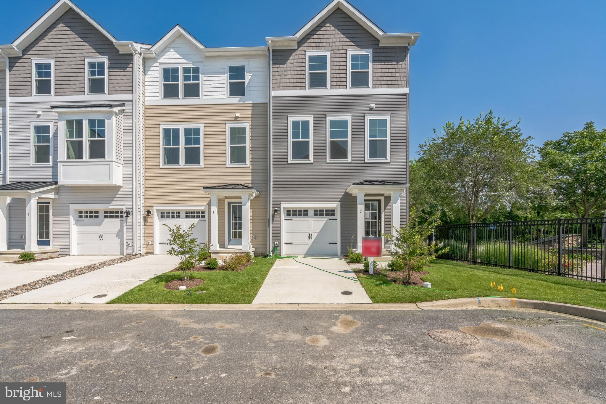 2 Riverside Wharf Cambridge, MD 21613 - Photo 2 of 38 a front view of multiple houses with yard