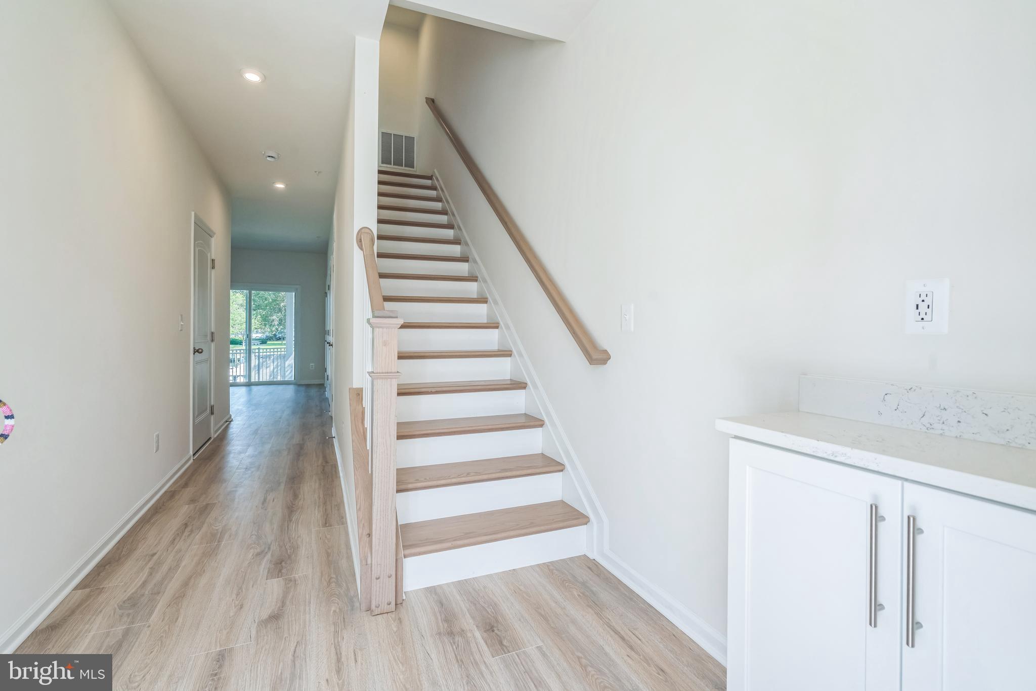 2 Riverside Wharf Cambridge, MD 21613 - Photo 3 of 38 a view of a hallway with wooden floor and entryway
