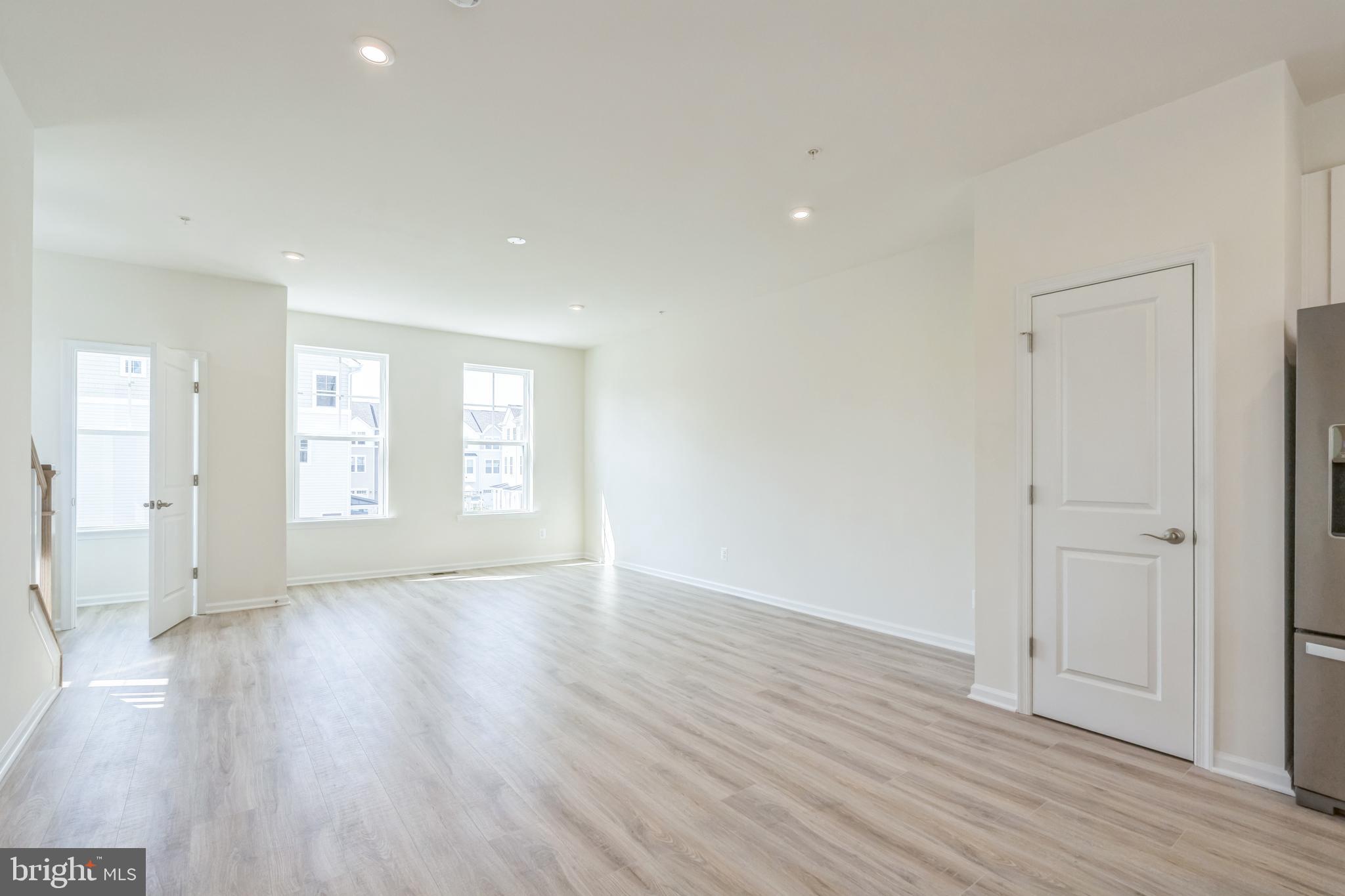 2 Riverside Wharf Cambridge, MD 21613 - Photo 8 of 38 a view of an empty room with wooden floor and a window