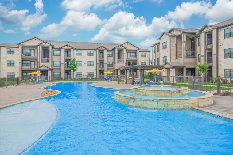 9393 Fm 1960 Bypass Road West, Unit 4106 Humble, TX 77338 - Photo 21 of 28 a view of building with yard swimming pool and outdoor seating