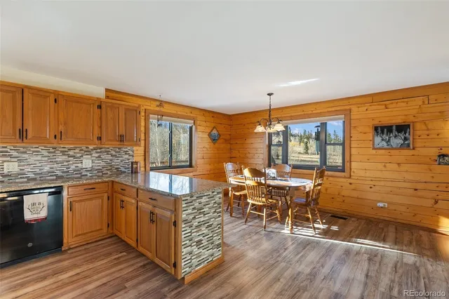 a open kitchen with stainless steel appliances granite countertop a stove and cabinets
