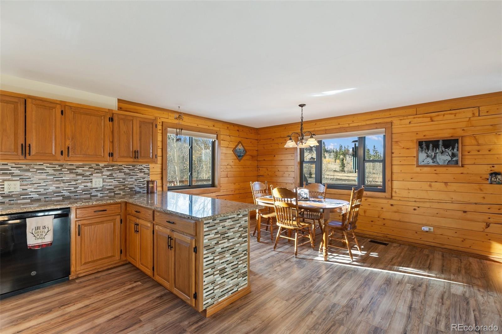 2387 Buffalo Ridge Road Como, CO 80456 - Photo 14 of 50 a open kitchen with stainless steel appliances granite countertop a stove and cabinets