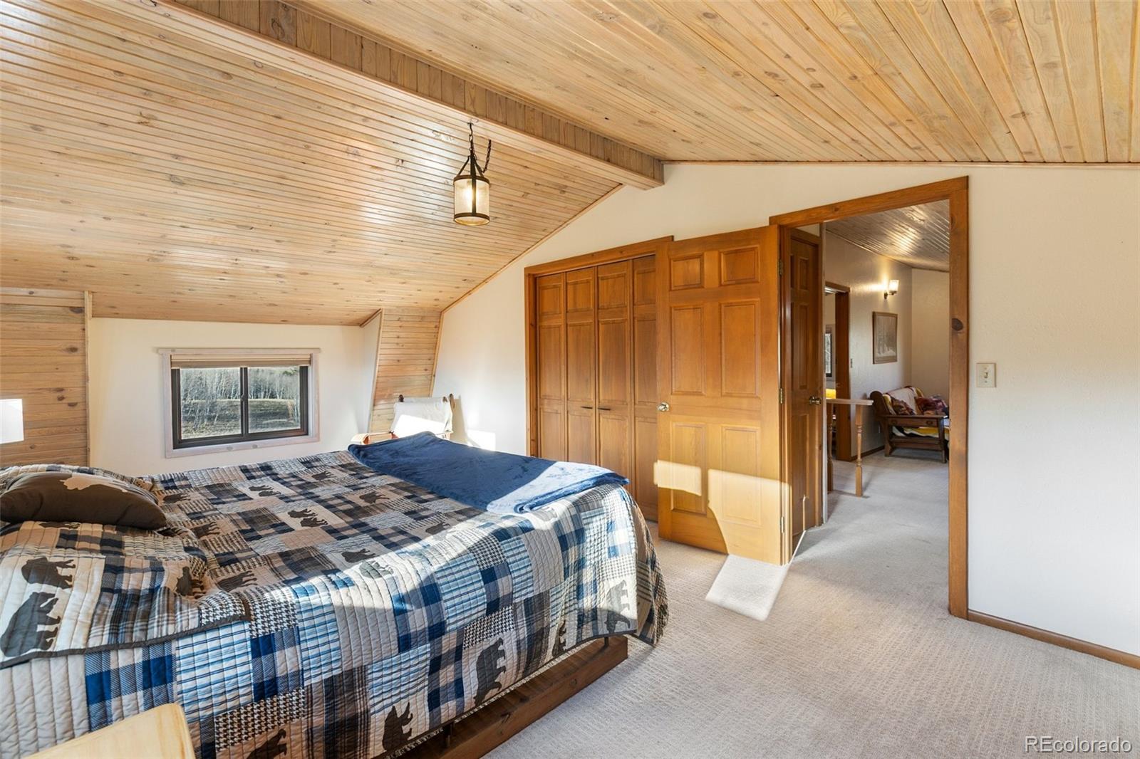 2387 Buffalo Ridge Road Como, CO 80456 - Photo 24 of 50 a spacious bedroom with a bed and a table