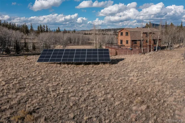 a view of a backyard with sitting area