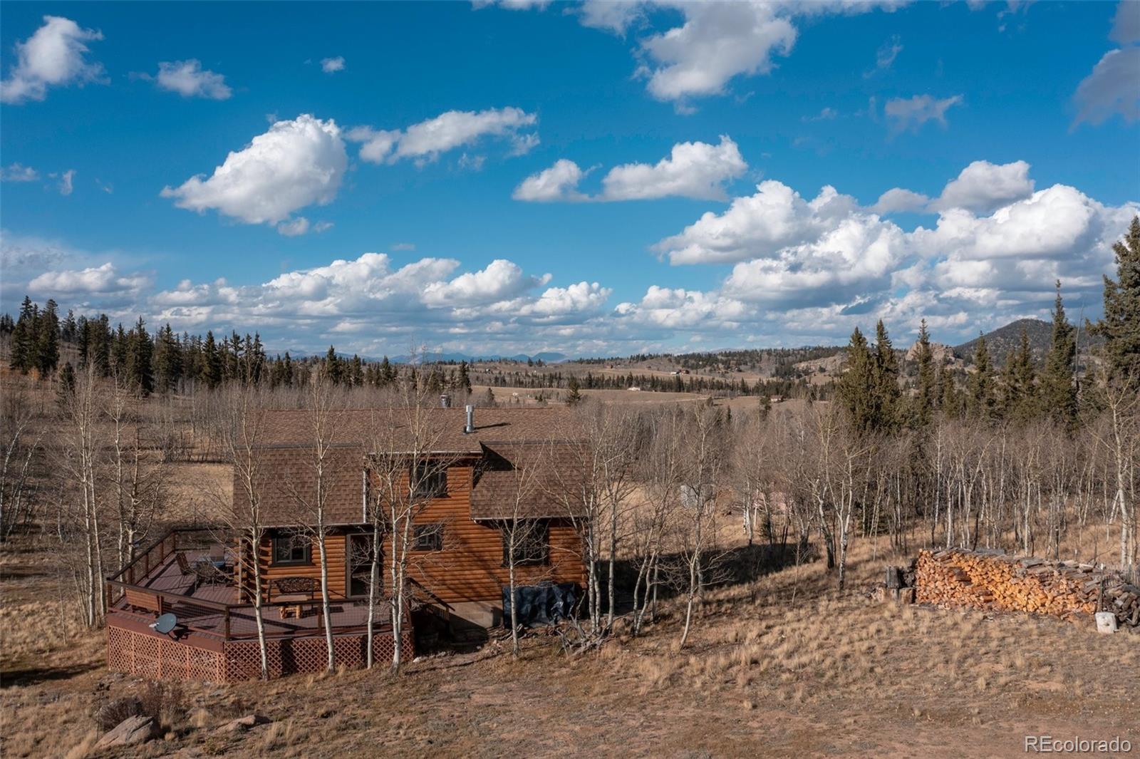 2387 Buffalo Ridge Road Como, CO 80456 - Photo 45 of 50 a view of a lake with table and chairs