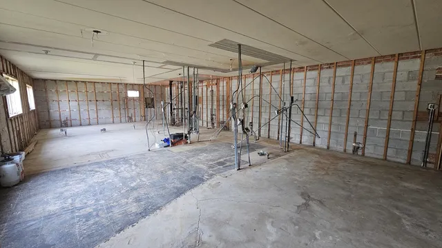 a view of empty room with floor to ceiling window