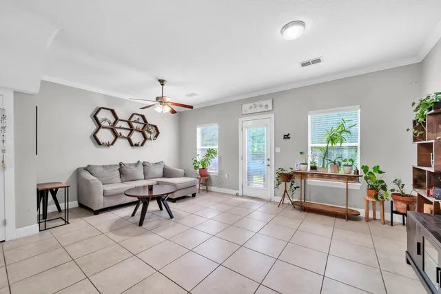 a living room with furniture and white walls