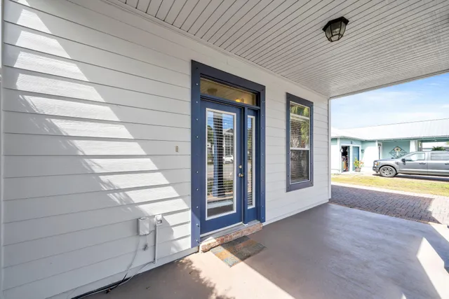 a view of an empty room and fire place