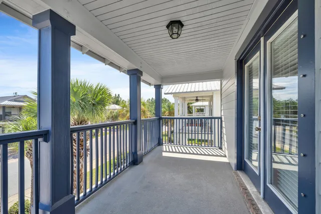a view of a porch with wooden floor and outside space