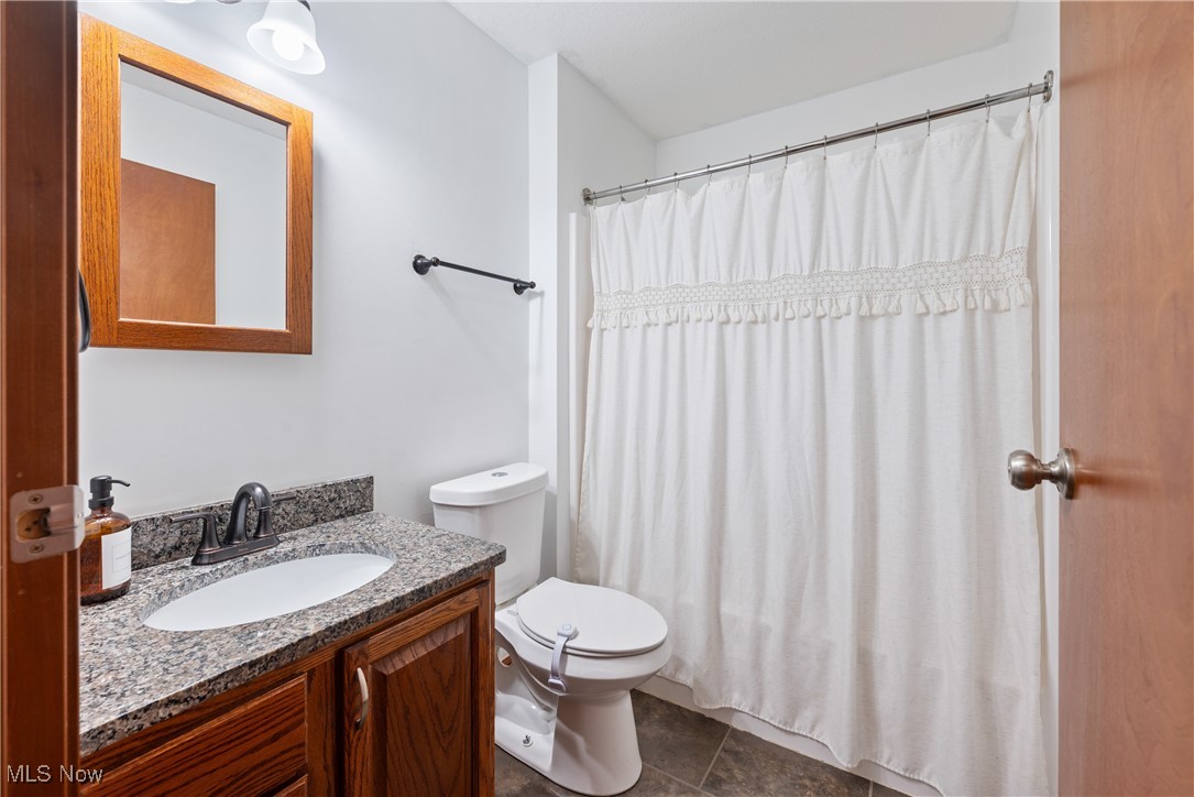 399 Wilder Road Vinton, OH 45686 - Photo 18 of 36 Full bath featuring vanity and a shower with shower curtain