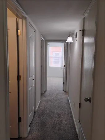 a view of a chandelier fan in a room