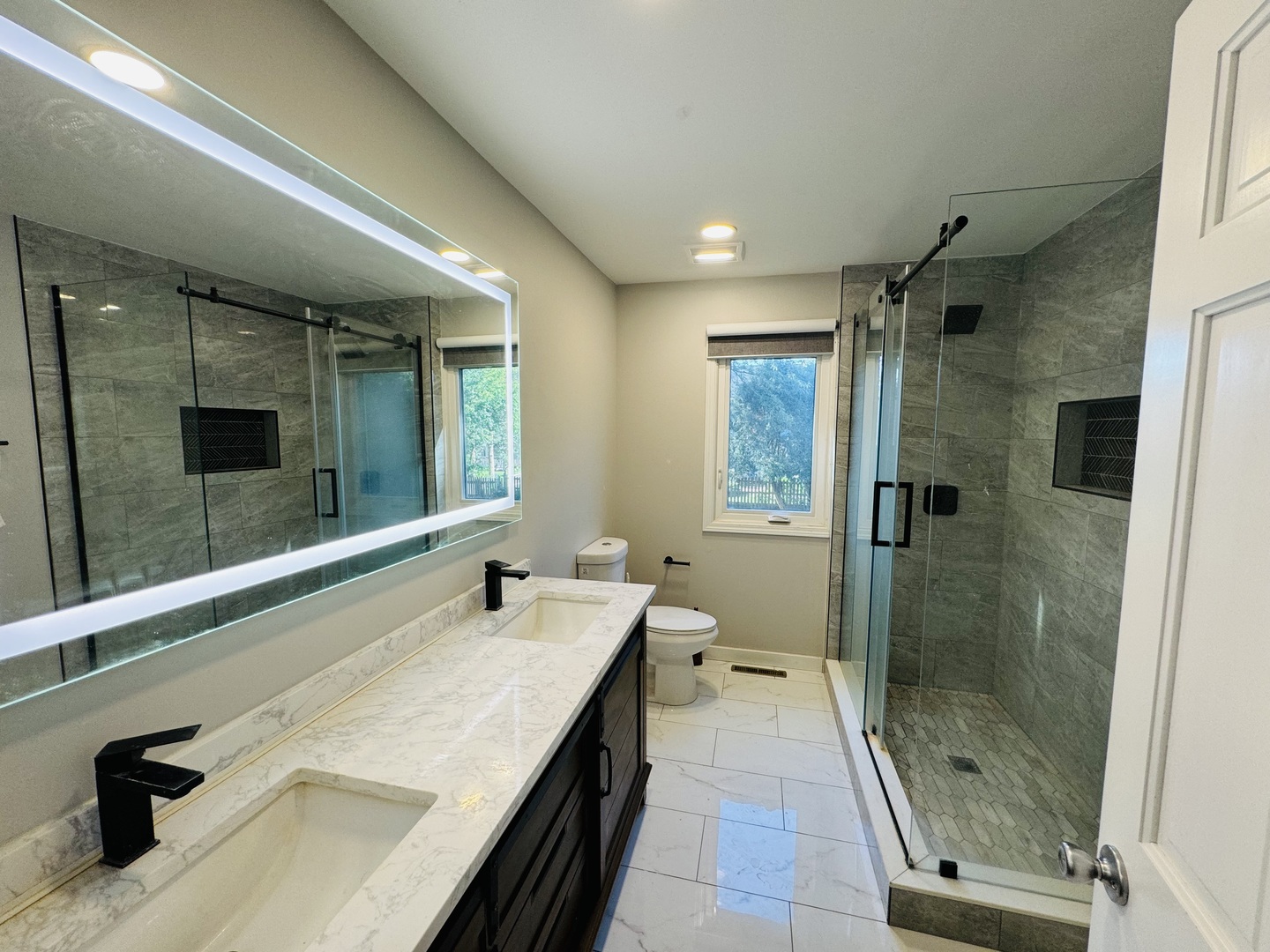 1398 East Gartner Road Naperville, IL 60540 - Photo 15 of 31 a bathroom with a double vanity sink mirror and shower