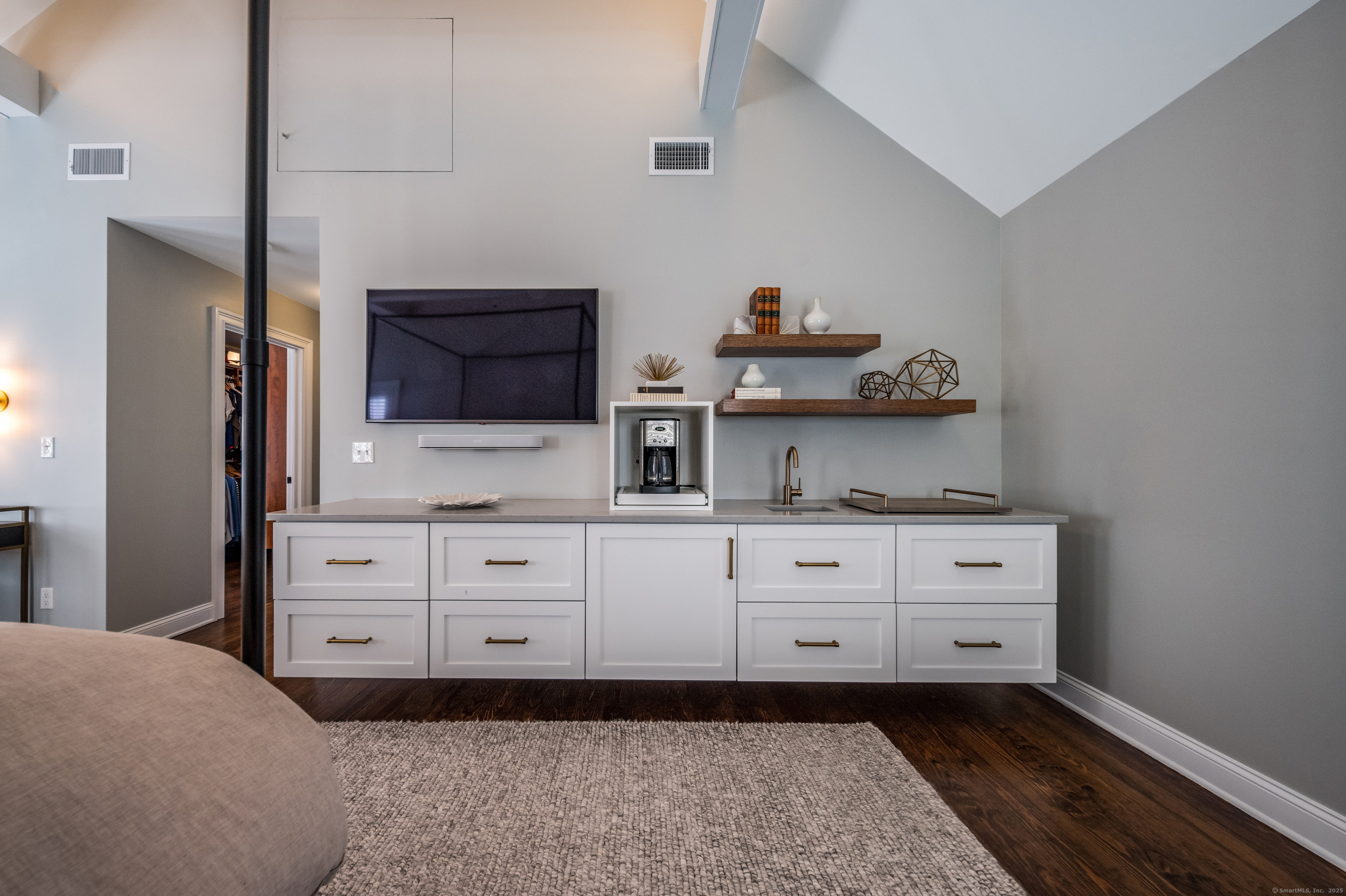 137 Liberty Street Madison, CT 06443 - Photo 13 of 40 a spacious bedroom with a bed and a cabinet