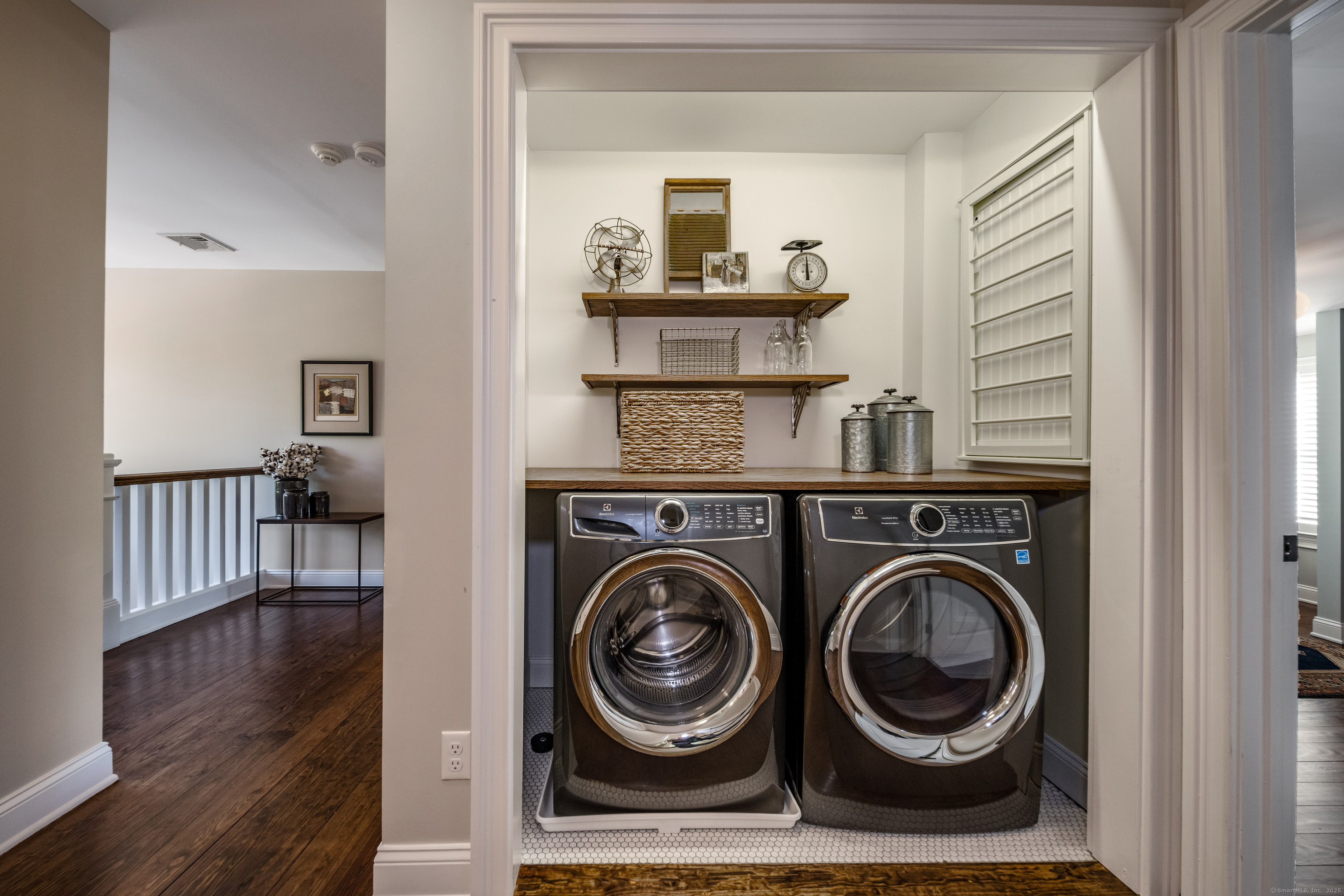 137 Liberty Street Madison, CT 06443 - Photo 15 of 40 a view of livingroom with washer and dryer
