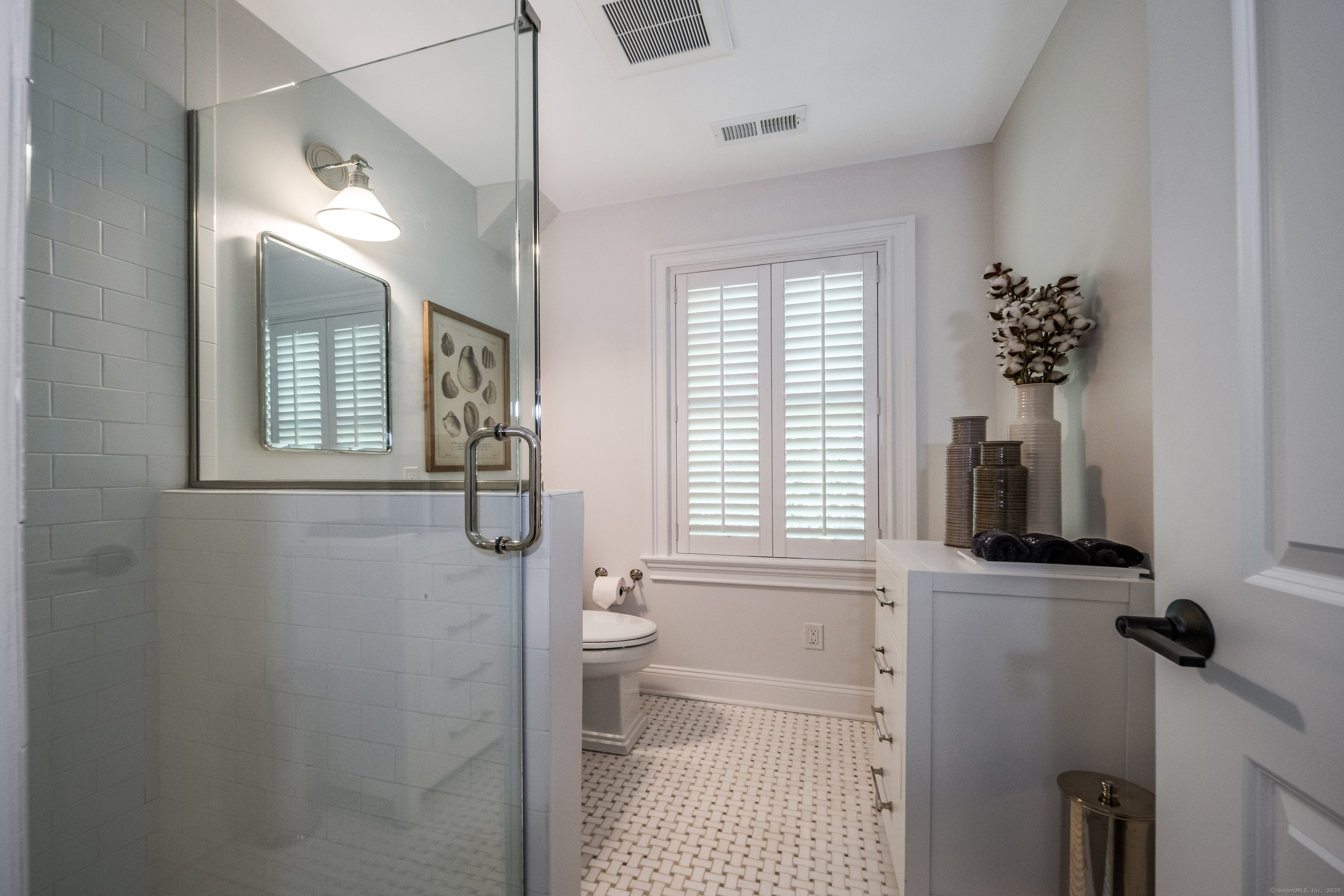 137 Liberty Street Madison, CT 06443 - Photo 20 of 40 a bathroom with a sink a toilet and a shower