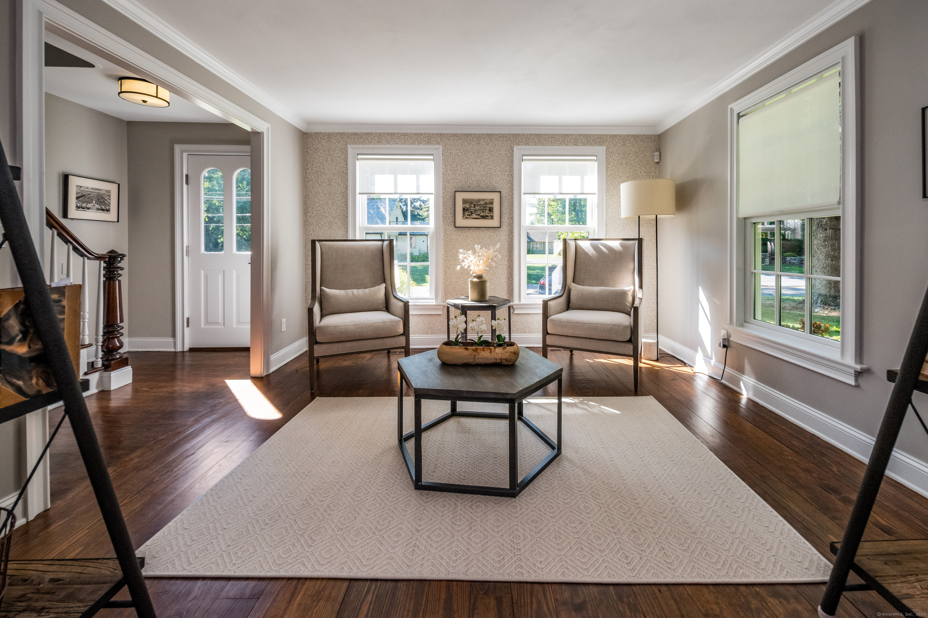137 Liberty Street Madison, CT 06443 - Photo 2 of 40 a living room with furniture and a flat screen tv