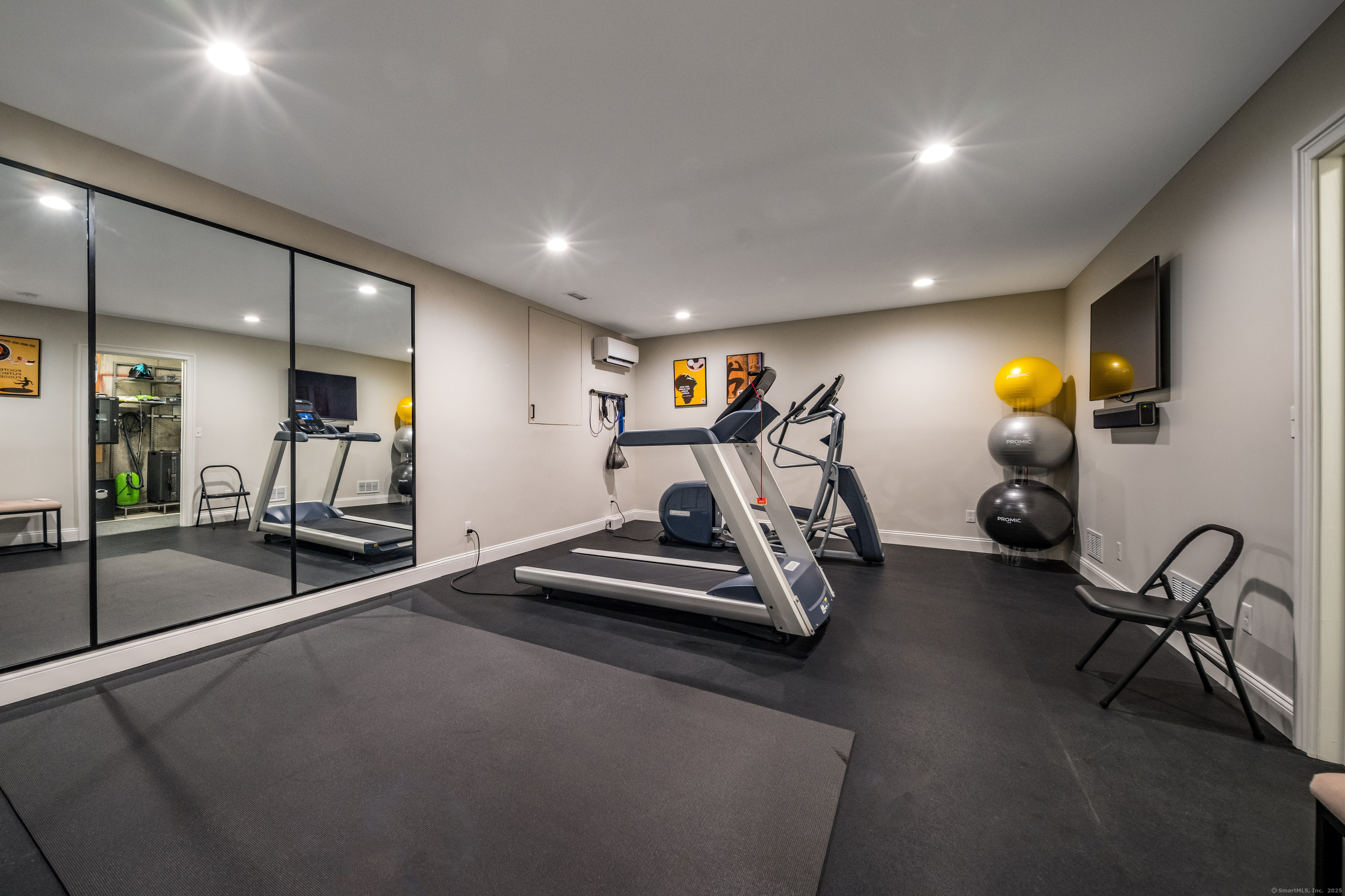 137 Liberty Street Madison, CT 06443 - Photo 22 of 40 a view of a room with gym equipment