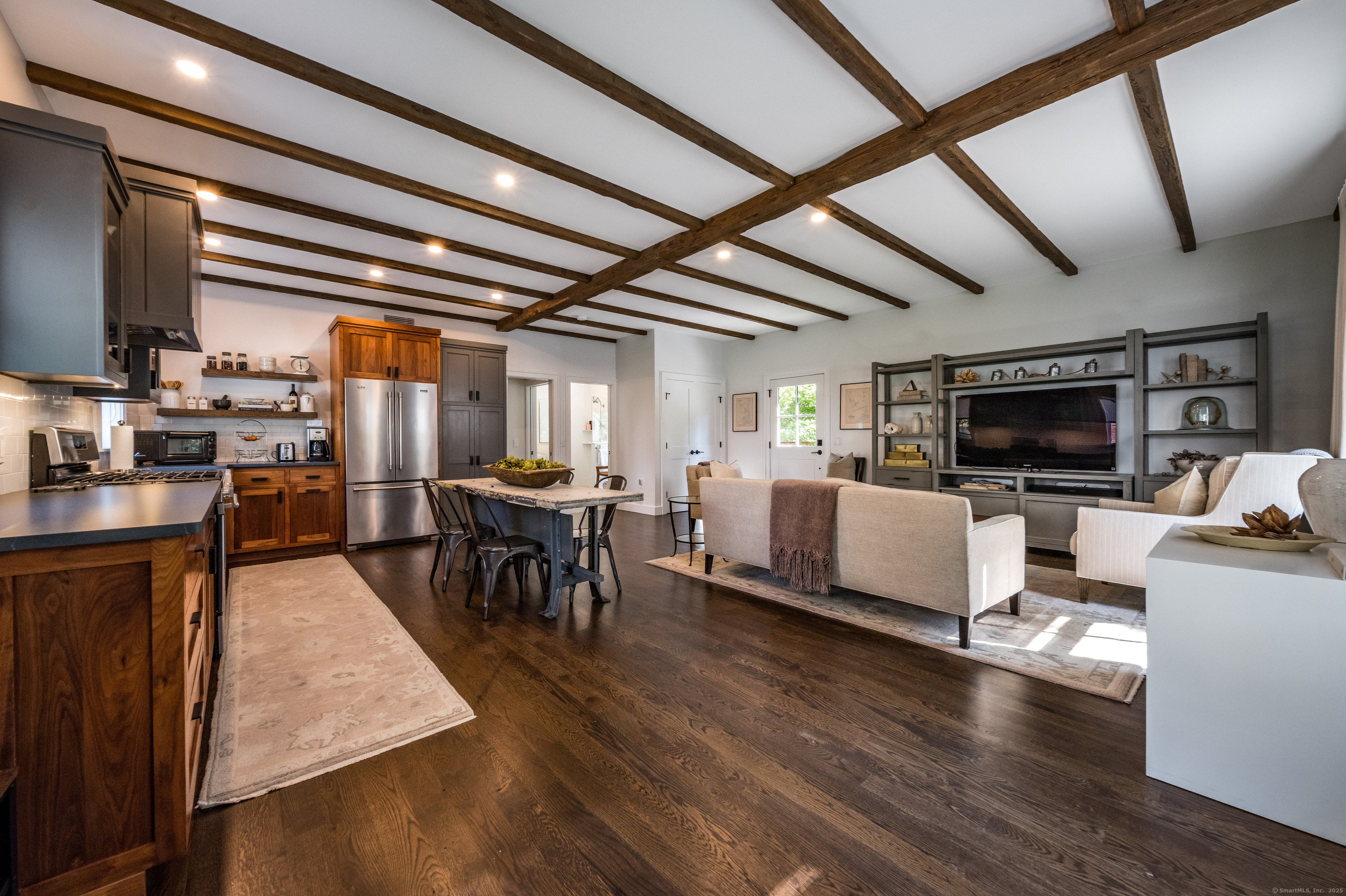 137 Liberty Street Madison, CT 06443 - Photo 23 of 40 a living room with lots of furniture and kitchen view