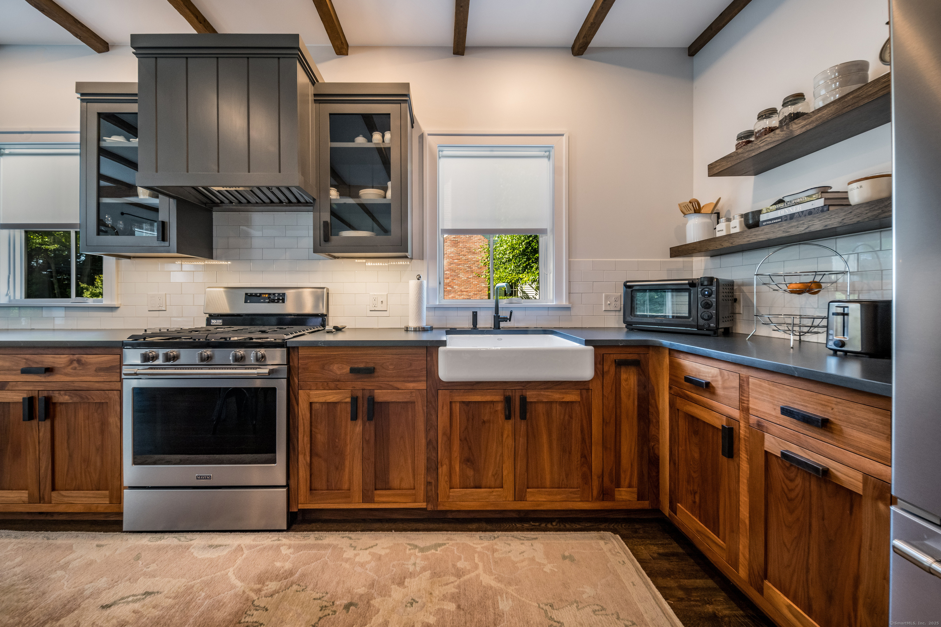 137 Liberty Street Madison, CT 06443 - Photo 24 of 40 a kitchen with stainless steel appliances granite countertop a stove a sink dishwasher and a refrigerator