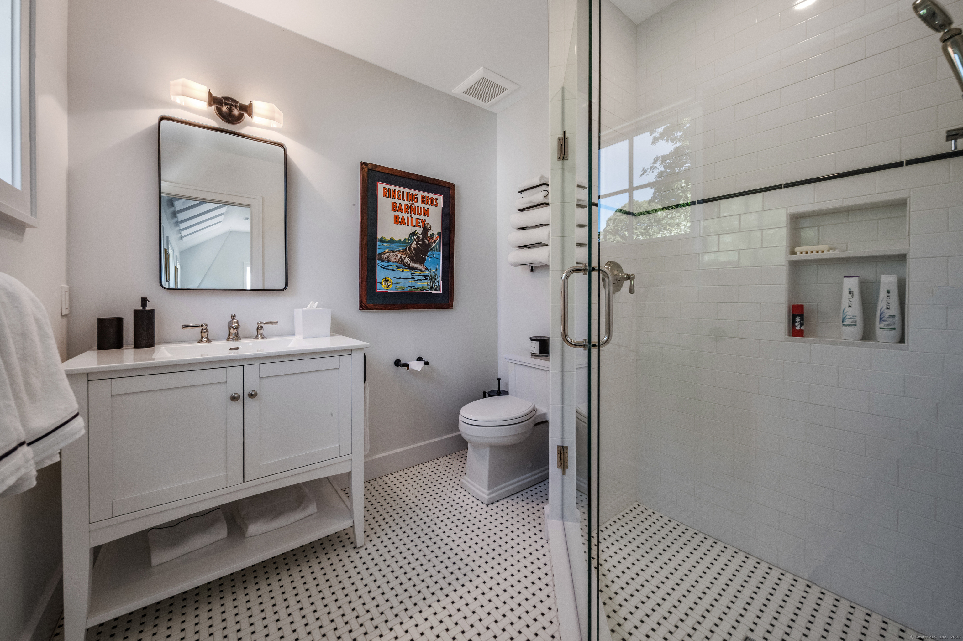137 Liberty Street Madison, CT 06443 - Photo 28 of 40 a bathroom with a toilet sink double vanity and mirror
