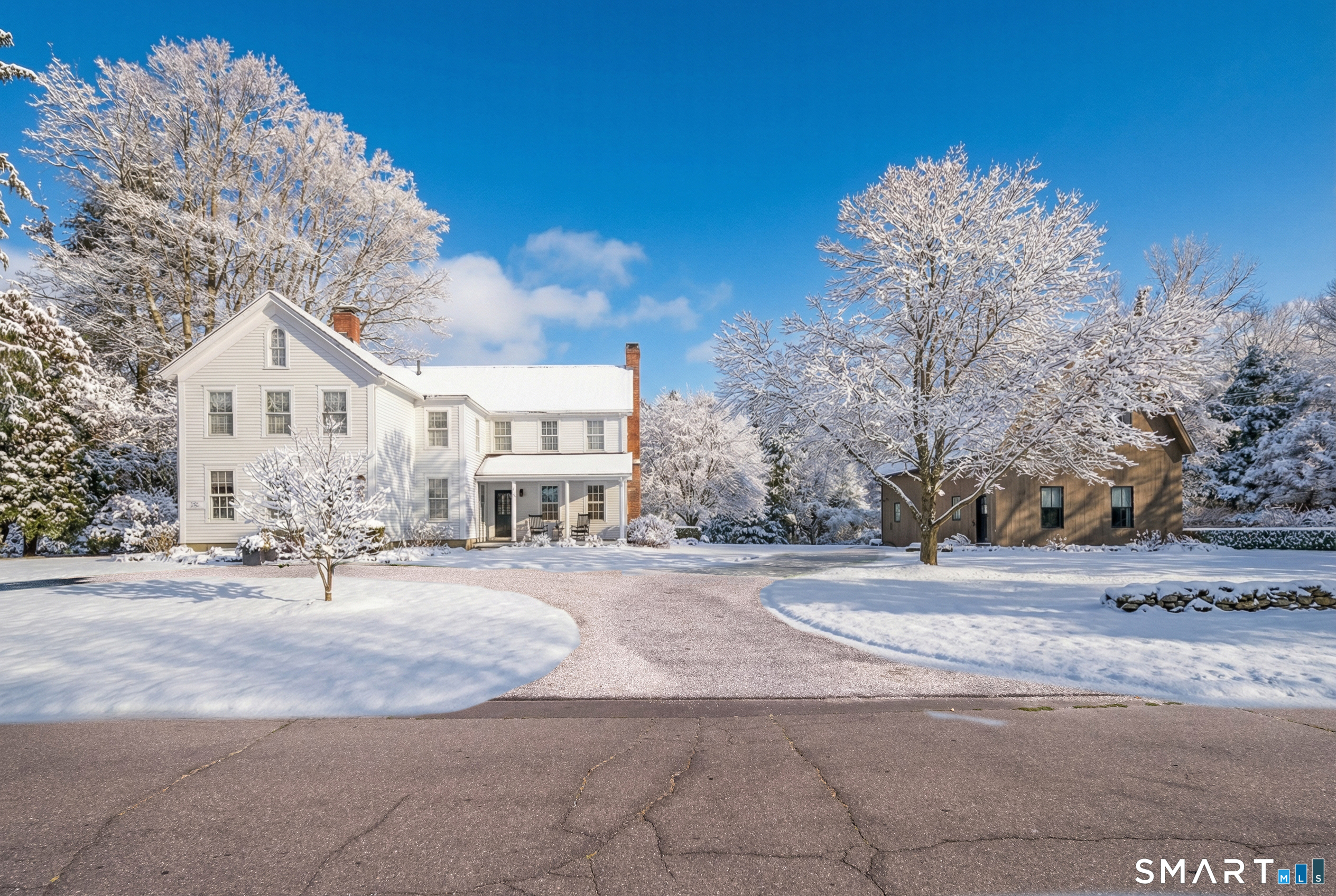 137 Liberty Street Madison, CT 06443 - Photo 32 of 40 a view of a house with a snow on the road